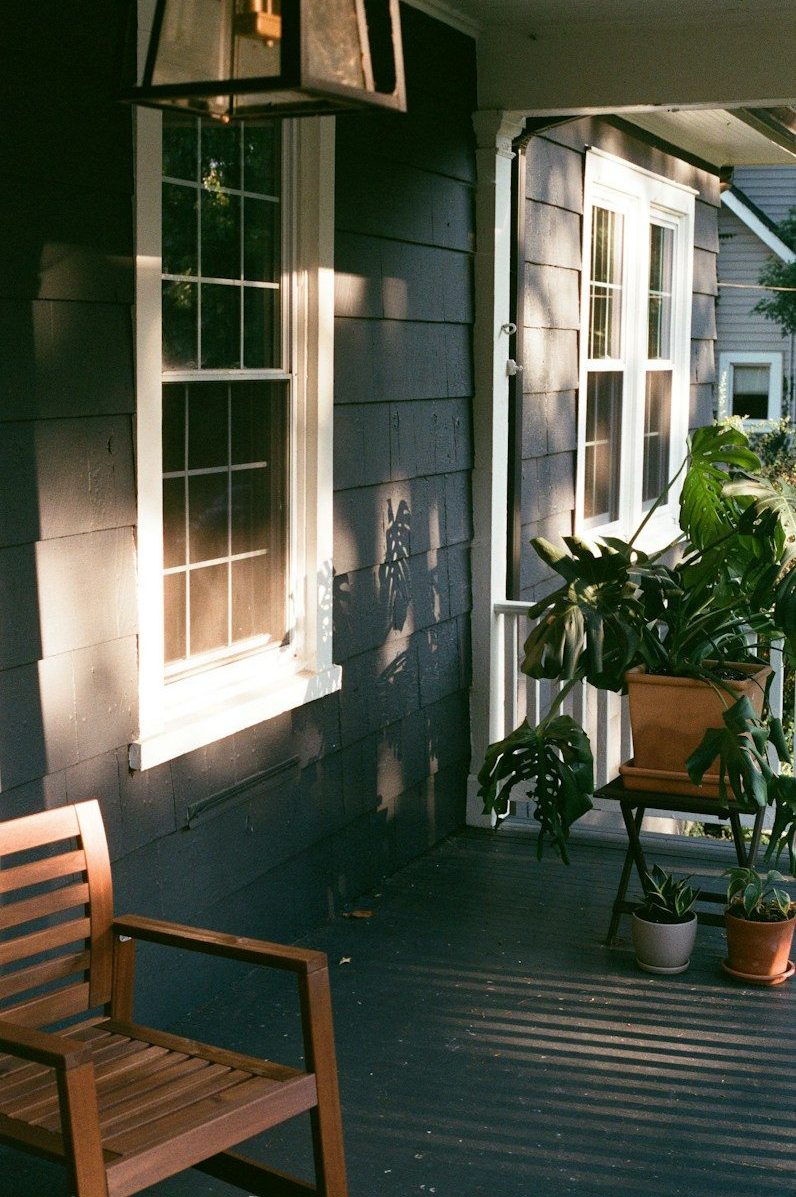 a bench next to a window
